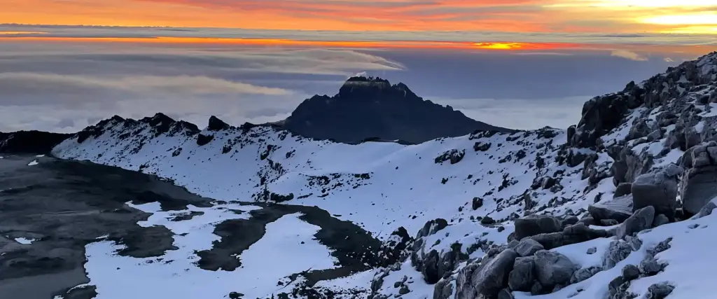 Sunrise over the clouds and snow near the summit of Kilimanjaro