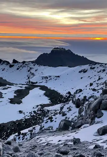 Snow-covered rocks on Kilimanjaro at sunrise
